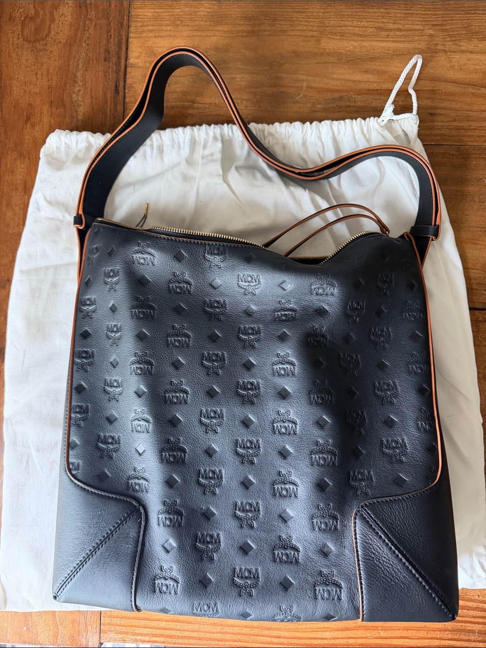 MCM Black Embossed Logo Leather Hobo Bag with Tan Trim
